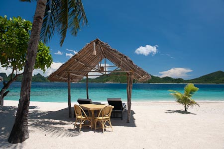 Palm fringed beaches, bright white sand and turquoise waters and of course, a little sunbathing cabana