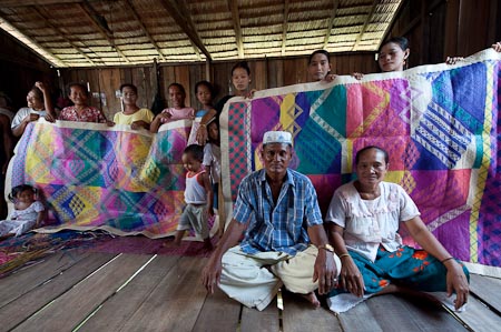 Irresistible Bajau woven mats shown off by a Bajau family. We bought one of these and added to our already super overweight luggage  