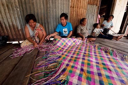 WWF volunteer Hermand in his livelihood weaving project site Maliangin Besar 