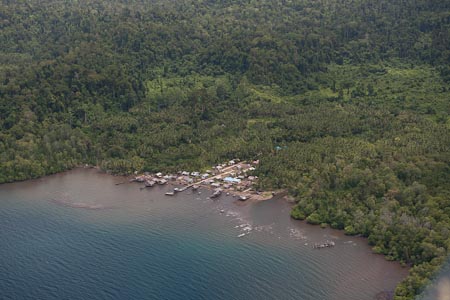 A local Papuan village with very clear signs of coastal run offs and siltation