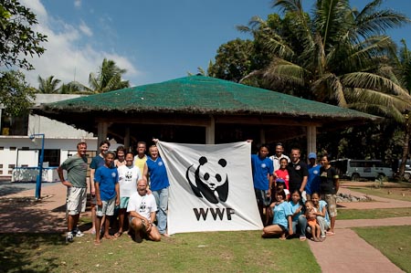 Apo Reef Club staff and guests pose with the giant Panda