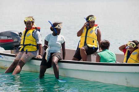 Teacher Lorna Romaso leads a group of 16 students to snorkel and learn about the reef