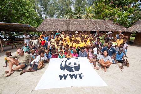 A lovely group photo of our well travelled WWF flag with the students of Enuk village and some parents with the Freunds, the Amons and Katrin of ExtraTours Germany 