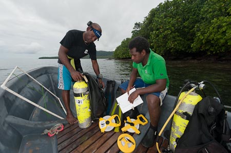 WWF SI's Tingo Lele & Bill Apusae prepare the dive and research gear for a transect activity in the quiet part of Tetepare lagoon