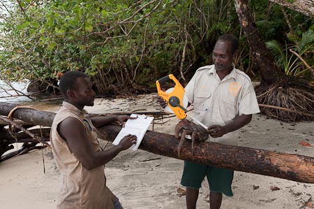 Tetepare Rangers measure and write down data for every coconut crab they capture and release back to the hole