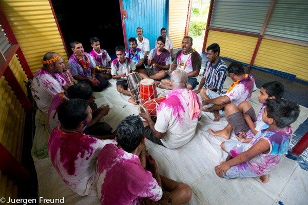 Holi in temple. Men performed ritual chants, beat drums and small brass cymbals.