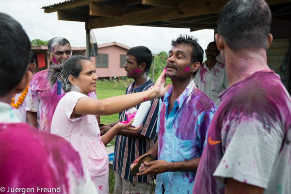  Colours from violet, pink, blue, yellow and white powder were poured onto everybody's neck, head and faces. 