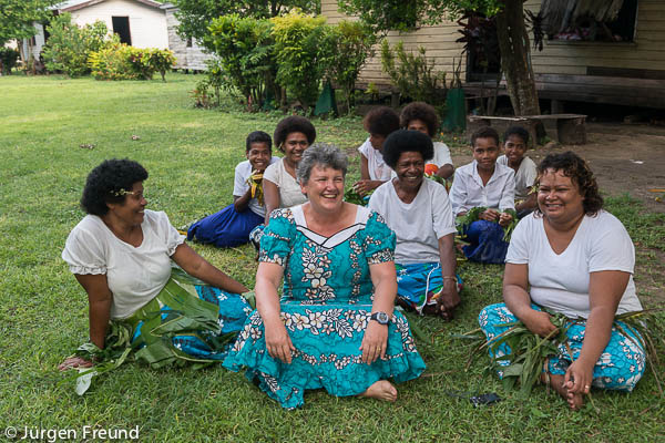 Sally Baily of WWF South Pacific sits with her Fijian family from Ligaulevu Village..