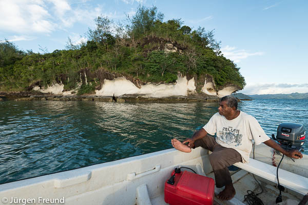 Kavewa Island Chief Meli Silibaravi driving the fiberglass boat to show us around his island.