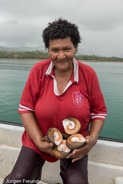 Vani collects high-value top-shaped sea snails or trochus, to eat the meat and sell the shells. The interior of these beautiful shells is pearly and iridescent because of layers of nacre or mother of pearl.