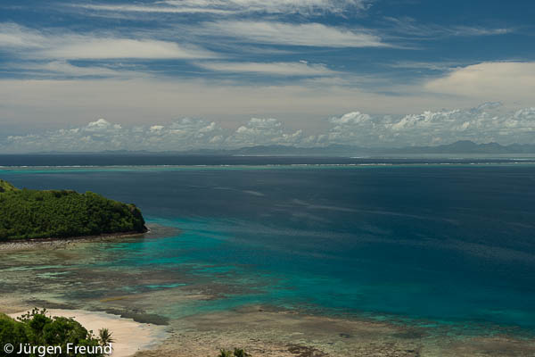 View from top of the mountain showing the turquoise waters of the Great Sea Reef.
