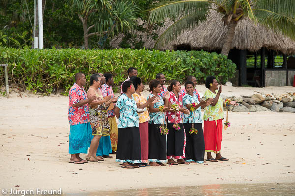 Nukubati Island Resort staff welcome new incoming guests with a song and a lei.