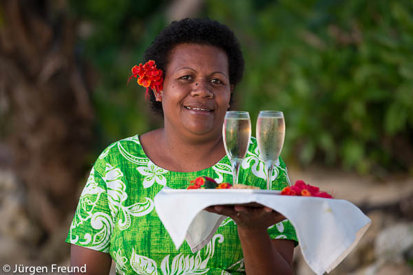 Nukubati Island Resort staff Sera Vaga brings our afternoon champagne and hors d'oeuvres to us during the shoot!