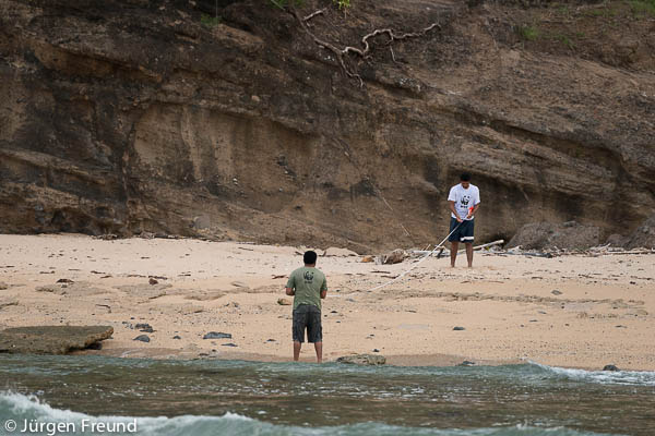 Laitia Tamata and Koli Musudroka of WWF South Pacific conduct a beach survey measuring the length and width of a beach that is a turtle nesting ground.
